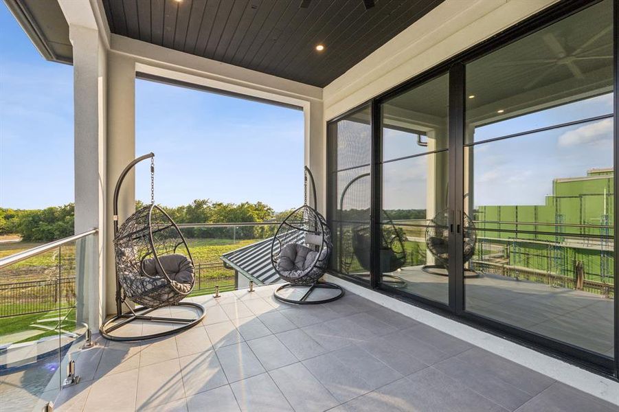 Balcony featuring wooden ceiling and a healthy amount of sunlight