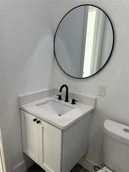 Bathroom with vanity and toilet