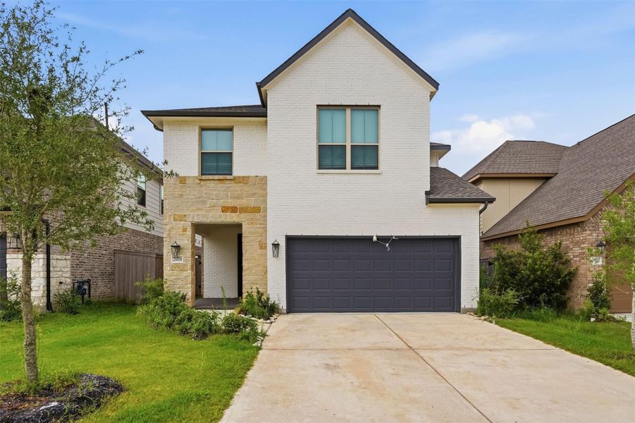 Front exterior of a new home in Candela, Richmond, TX, highlighting curb appeal (Image 1). Front exterior of a new home in Candela, Richmond, TX, highlighting curb appeal (Image 1).