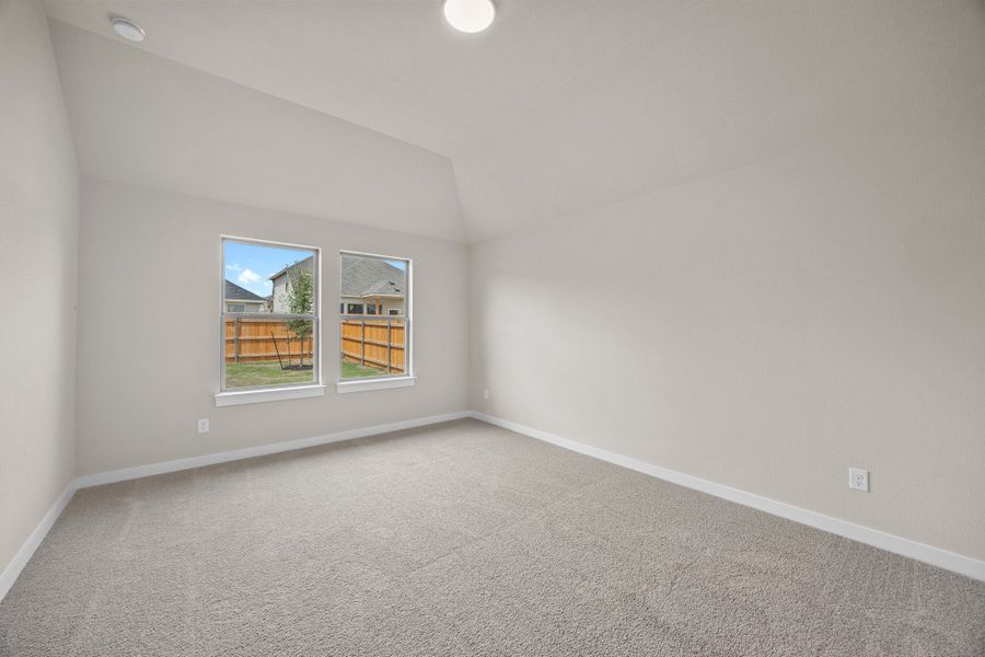 Primary Suite in the Brazos home plan by Trophy Signature Homes – REPRESENTATIVE PHOTO