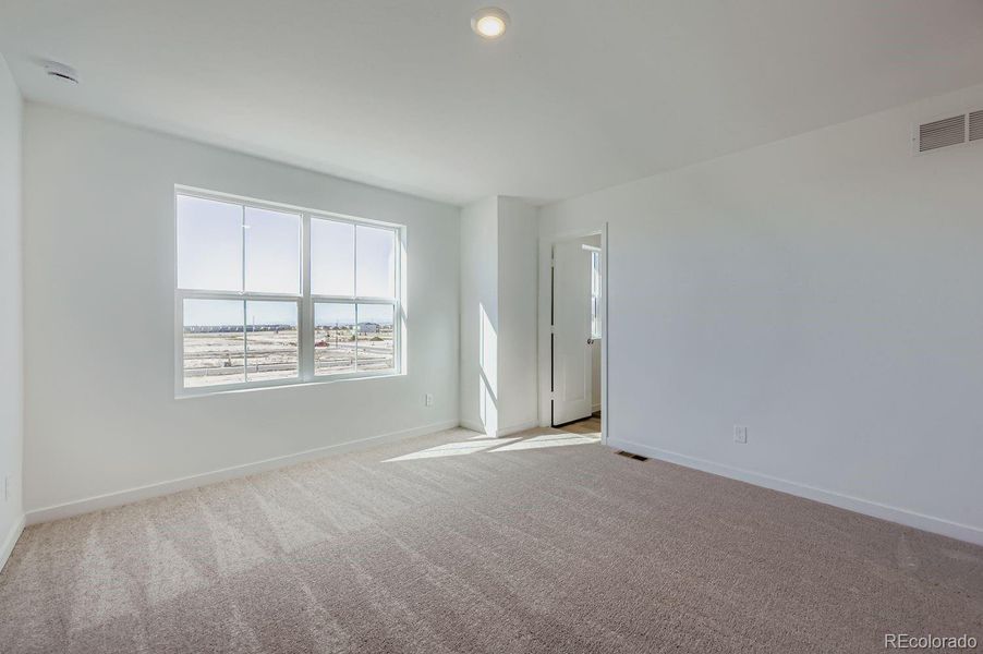 Spacious, unfurnished interior of a new home in Percheron: The Explorer Collection, Colorado Springs (Image 6).