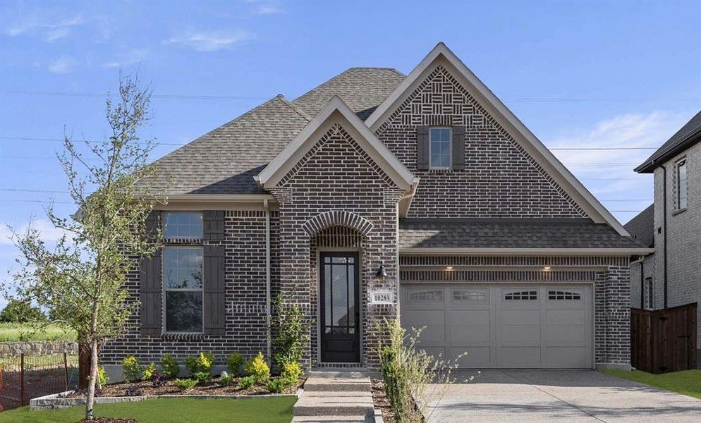 Front exterior of a new home in Inspiration, Wylie, TX, highlighting curb appeal (Image 13).