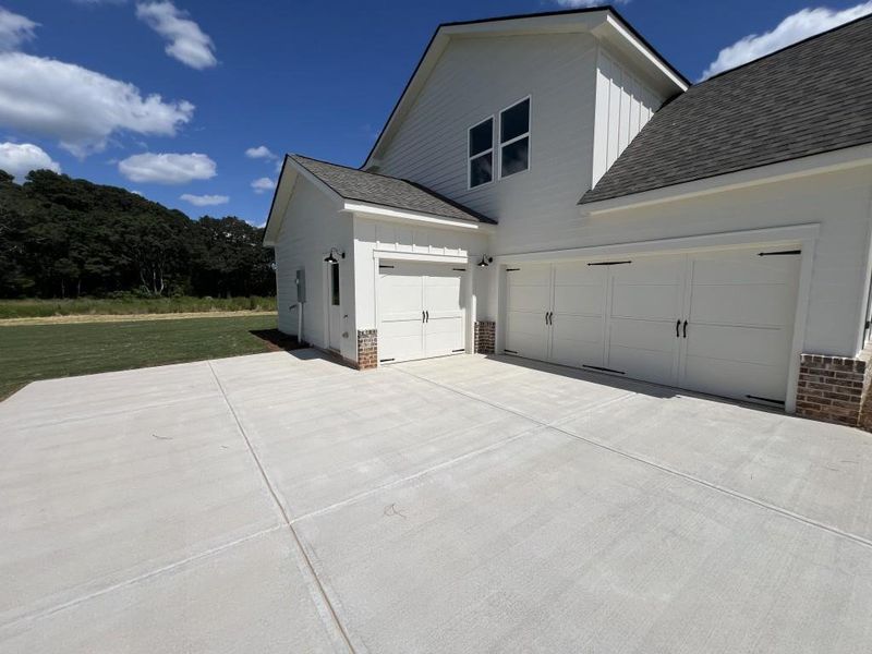 Front exterior of a new home in , Good Hope, GA, highlighting curb appeal (Image 22).