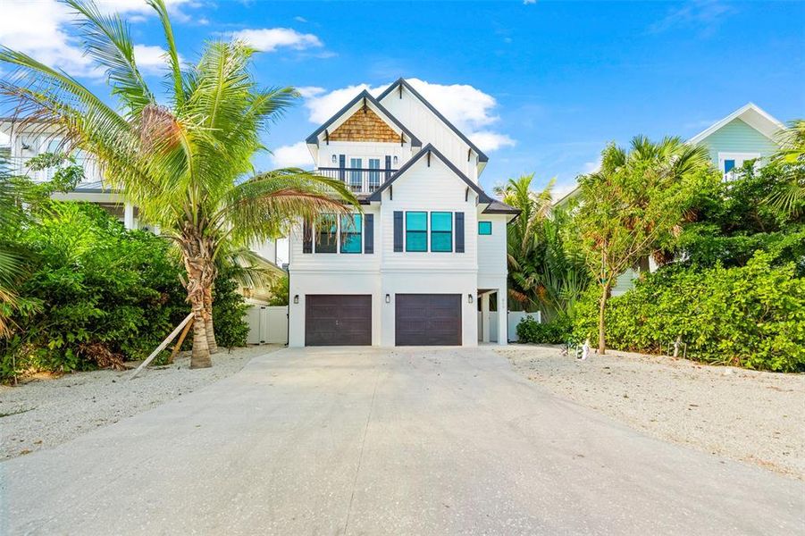 Front exterior of a new home in , Sarasota, FL, highlighting curb appeal (Image 21). Front exterior of a new home in , Sarasota, FL, highlighting curb appeal (Image 21).