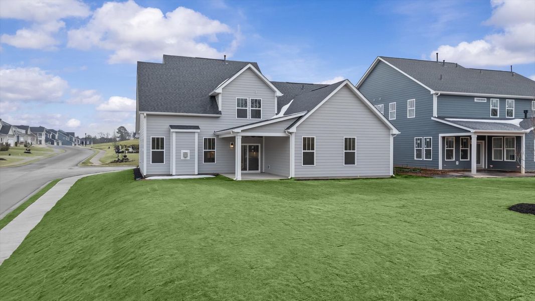 Tasteful rear porch provides a peaceful retreat and effortless indoor-outdoor flow
