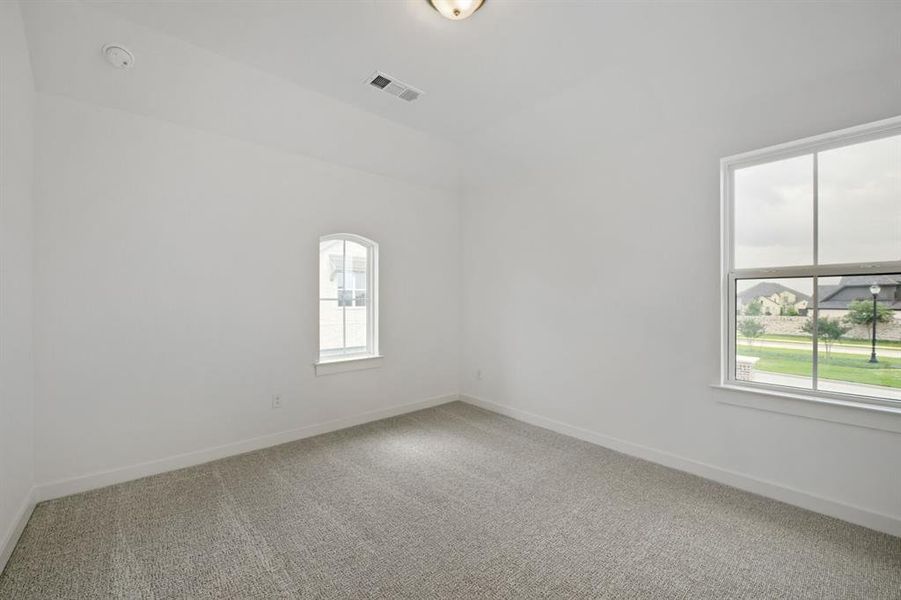 Neutral wall finishes, recessed ceiling light fixture, and contemporary carpet flooring Neutral wall finishes, recessed ceiling light fixture, and contemporary carpet flooring