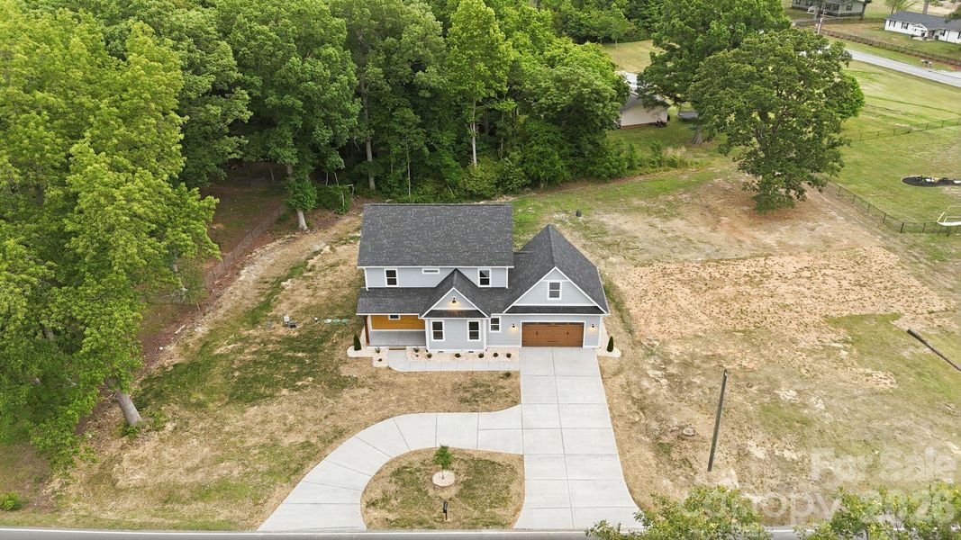 Front exterior of a new home in , Marshville, NC, highlighting curb appeal (Image 28).