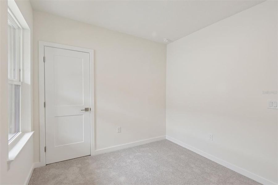 Spacious, unfurnished interior of a new home in Grasslands West, Lakeland (Image 26).