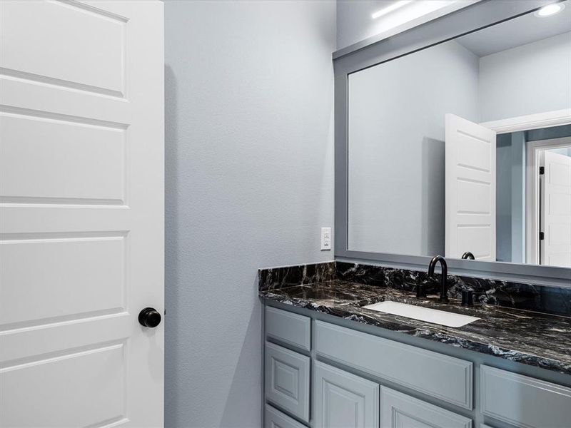 Bathroom featuring vanity Bathroom featuring vanity