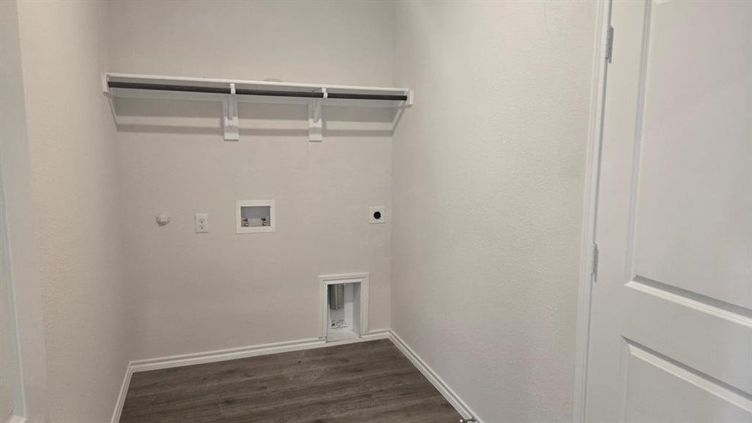 Laundry room featuring hookup for a washing machine, hookup for a gas dryer, dark wood-style floors, and hookup for an electric dryer
