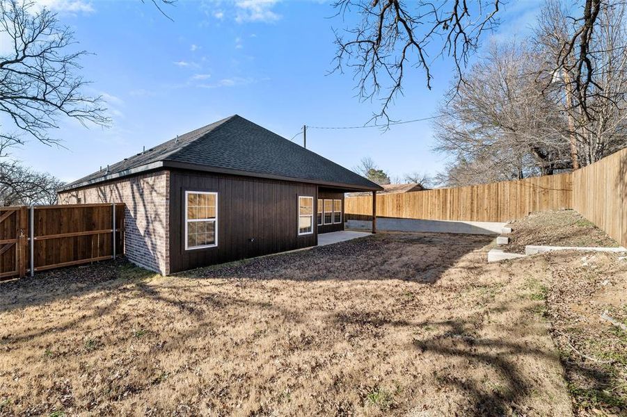 Rear view of house featuring a patio area