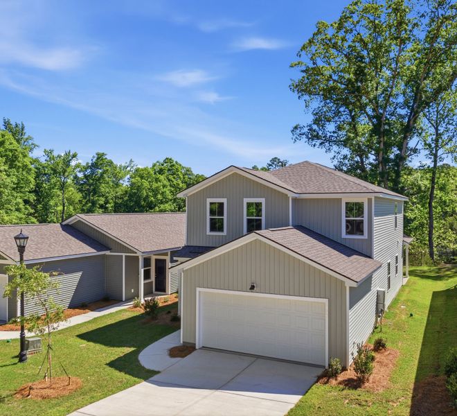 Front exterior of a new home in Grand Arbor, Blythewood, SC, highlighting curb appeal (Image 2). Front exterior of a new home in Grand Arbor, Blythewood, SC, highlighting curb appeal (Image 2).