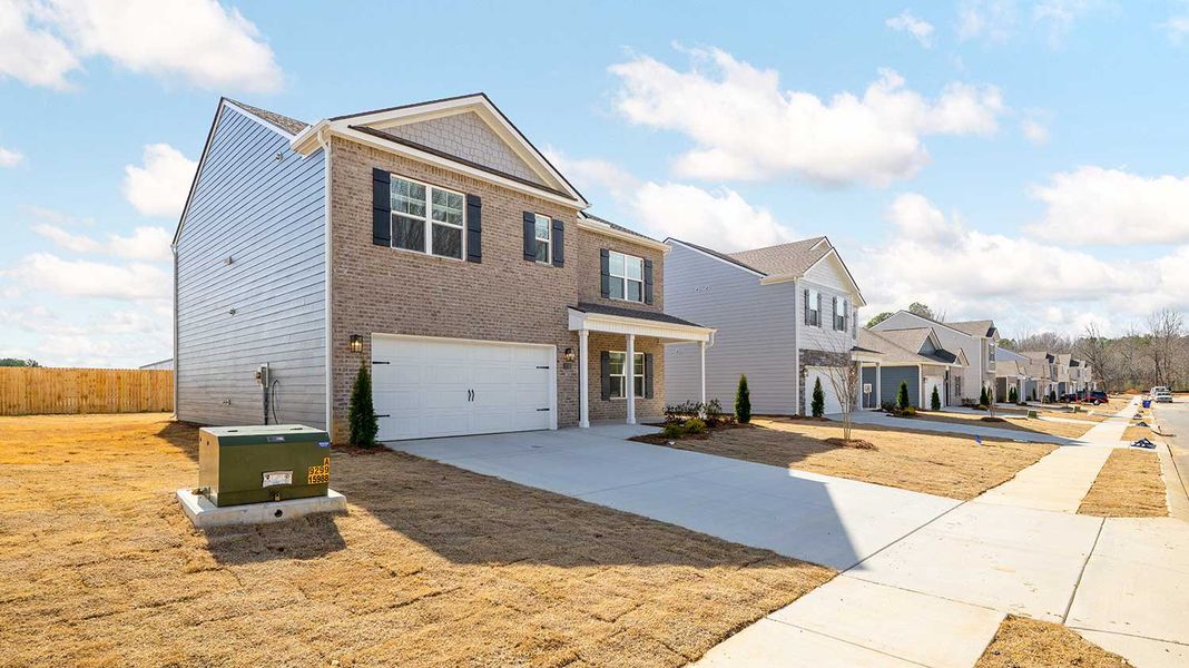 Front exterior of a new home in Fairview Hills, Cleveland, TN, highlighting curb appeal (Image 4). Front exterior of a new home in Fairview Hills, Cleveland, TN, highlighting curb appeal (Image 4).