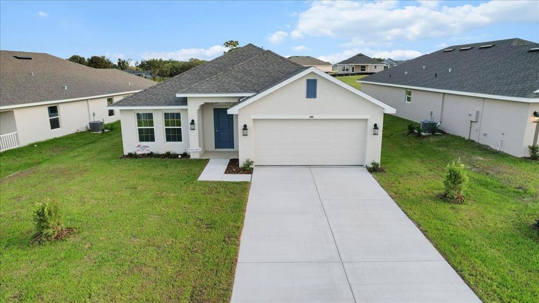 Front exterior of a new home in Twisted Oaks, Beverly Hills, FL, highlighting curb appeal (Image 29).