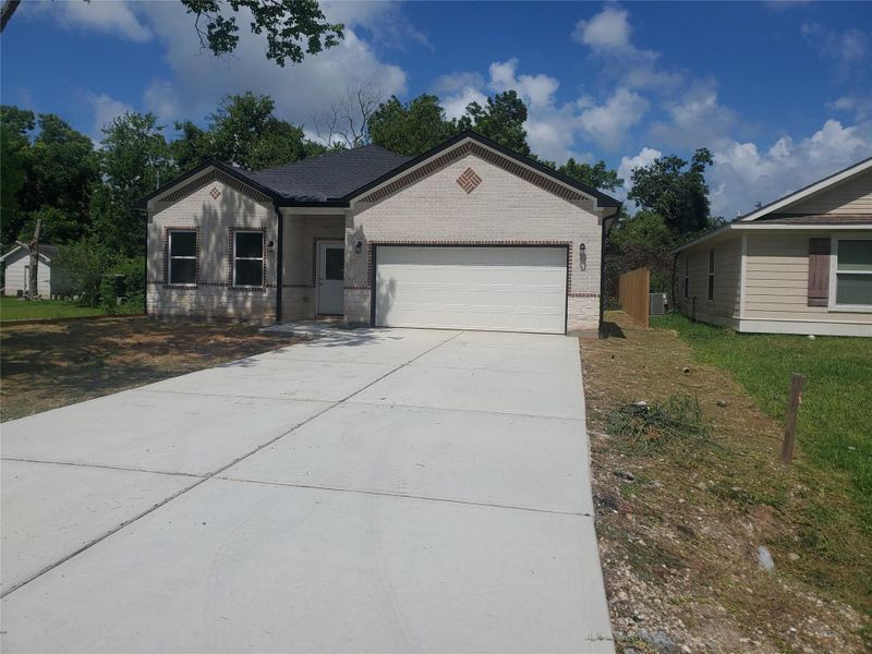 Front exterior of a new home in , Texas City, TX, highlighting curb appeal (Image 1). Front exterior of a new home in , Texas City, TX, highlighting curb appeal (Image 1).