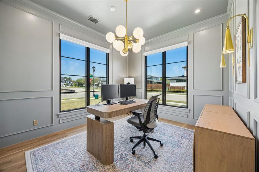 Take a left turn at the entry to access this private home office with corner views.