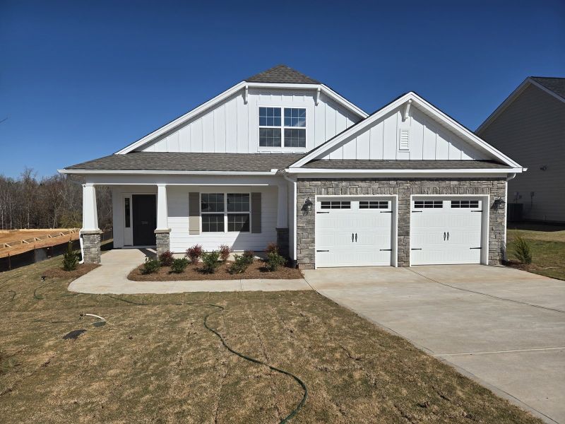 Front exterior of a new home in Cottages at Lake Emory, Inman, SC, highlighting curb appeal (Image 1).