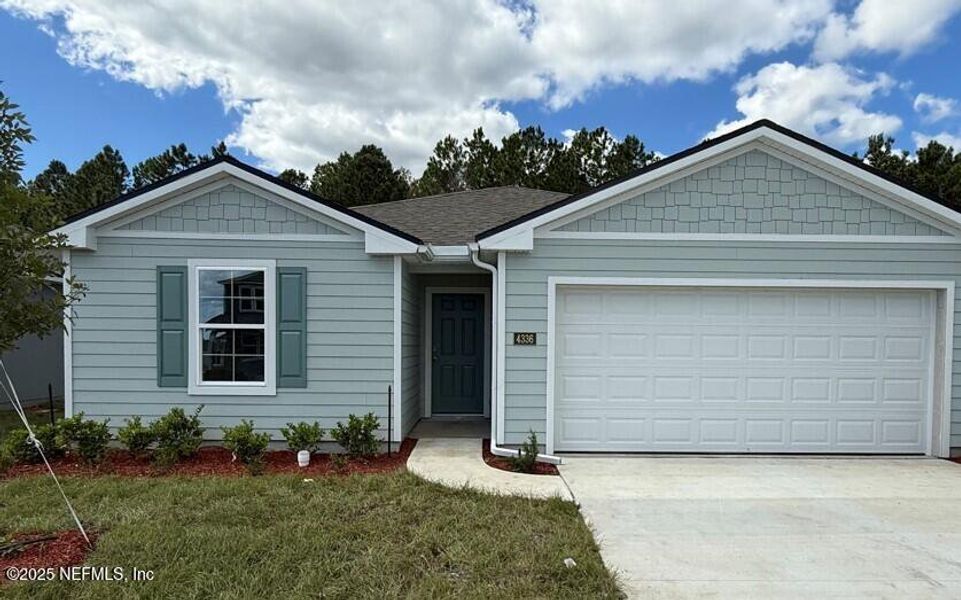 Front exterior of a new home in The Arbors, Jacksonville, FL, highlighting curb appeal (Image 24).