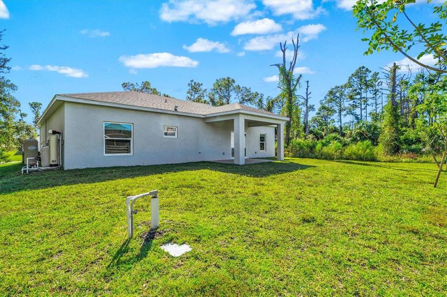 Exterior details and patio area of a home in , North Port (Image 27).