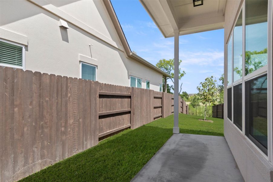 Fenced backyard with a patio Fenced backyard with a patio
