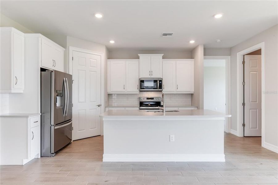 Furnished interior view inside a new home in Coral Lakes - Tradition & Express, Punta Gorda (Image 5).
