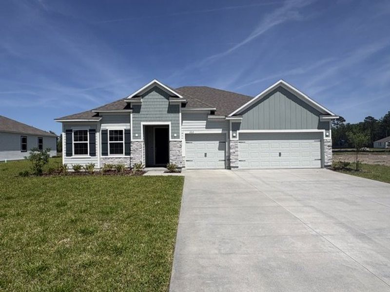 Front exterior of a new home in Winding River, St. Marys, GA, highlighting curb appeal (Image 1). Front exterior of a new home in Winding River, St. Marys, GA, highlighting curb appeal (Image 1).