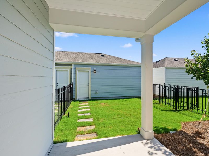 Exterior details and patio area of a home in North Creek Village - Townhomes, Huntersville (Image 4).