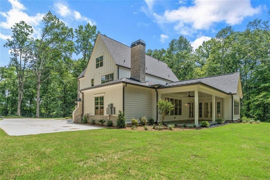 Front exterior of a new home in , Woodstock, GA, highlighting curb appeal (Image 22).