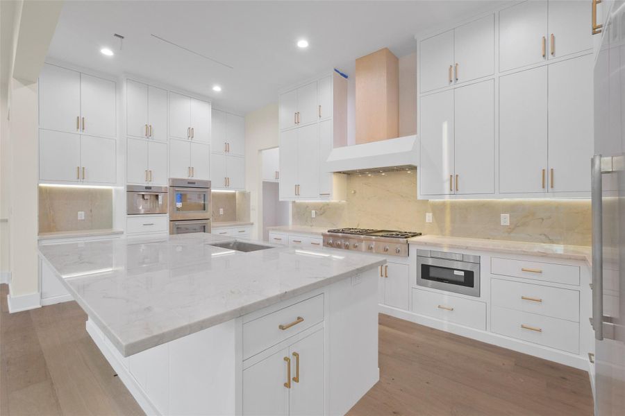 Concept image of chef inspired kitchen provides double ovens, built in espresso machine, six range gas cooktop and breakfast bar. The perfect space for quality time and meals. Concept image of chef inspired kitchen provides double ovens, built in espresso machine, six range gas cooktop and breakfast bar. The perfect space for quality time and meals.