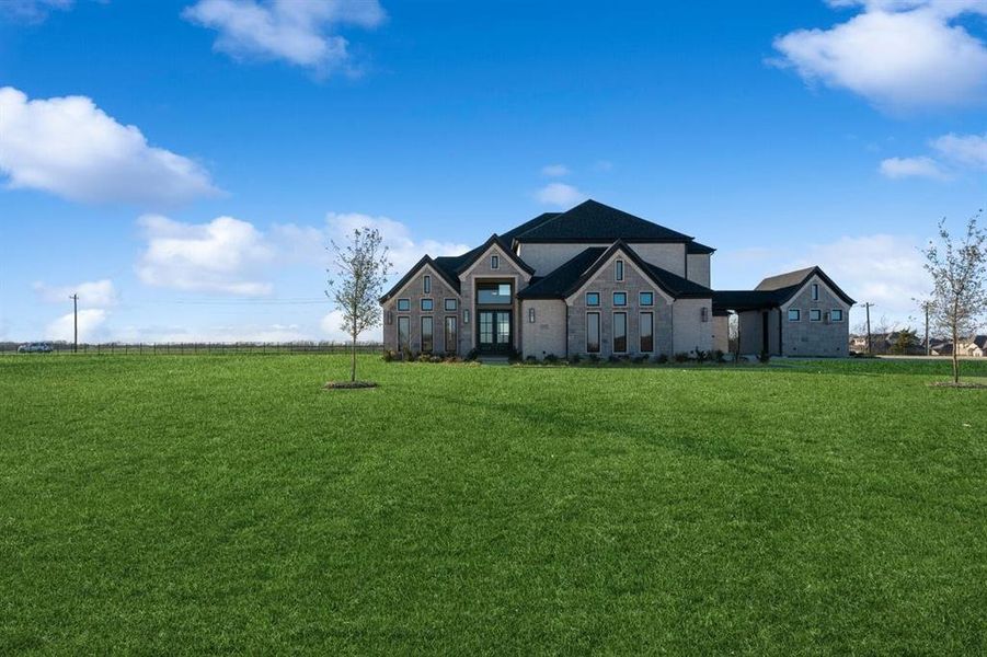 View of front of house with a front lawn