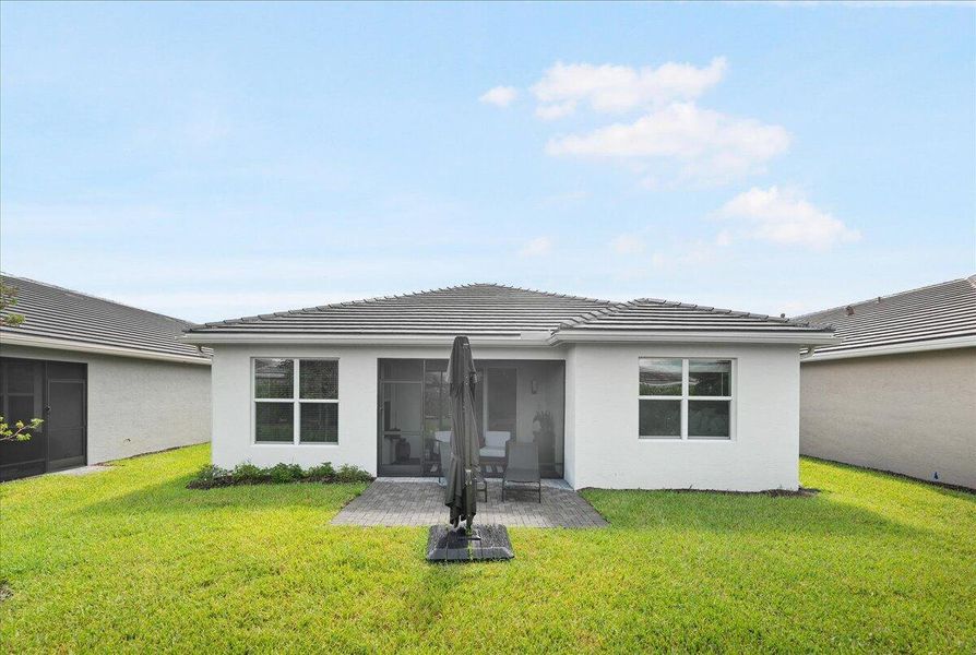 Front exterior of a new home in , Port St. Lucie, FL, highlighting curb appeal (Image 2).