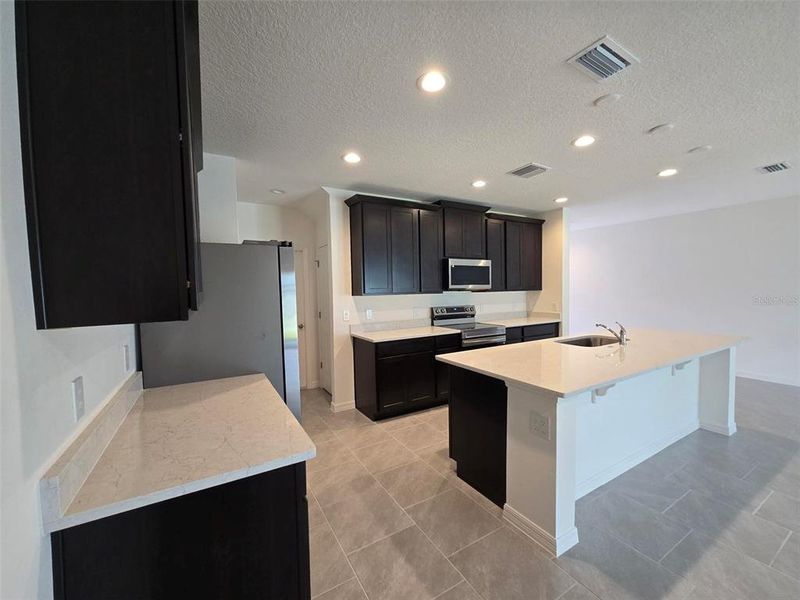 Furnished interior view inside a new home in Sky Lakes Estates, St. Cloud (Image 6).