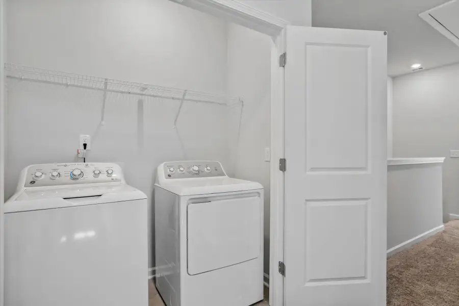 Furnished interior view inside a new home in West Main Townhomes, Sanford (Image 11).