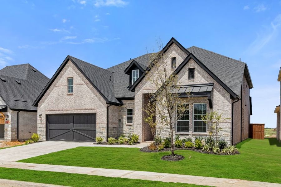 Representative exterior photo of a completed home built from the Grayson by UnionMain Homes in Cambridge Crossing, Celina, TX (Image 29).