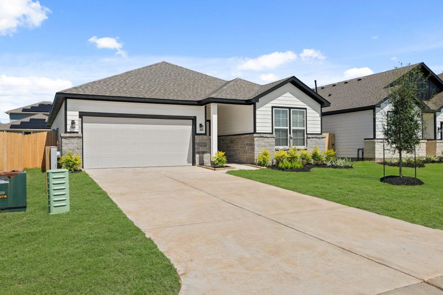 Front exterior of a new home in Caney Mills, Conroe, TX, highlighting curb appeal (Image 15).