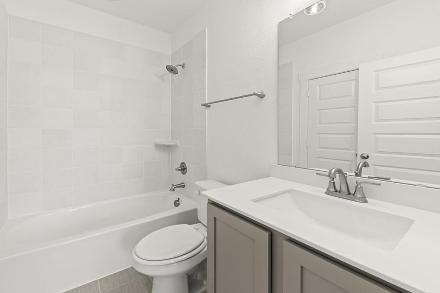 Representative furnished interior of a home built from the Olive III Harrington Trails Cornerstone I Series by Brohn Homes in Harrington Trails, New Caney (Image 12).