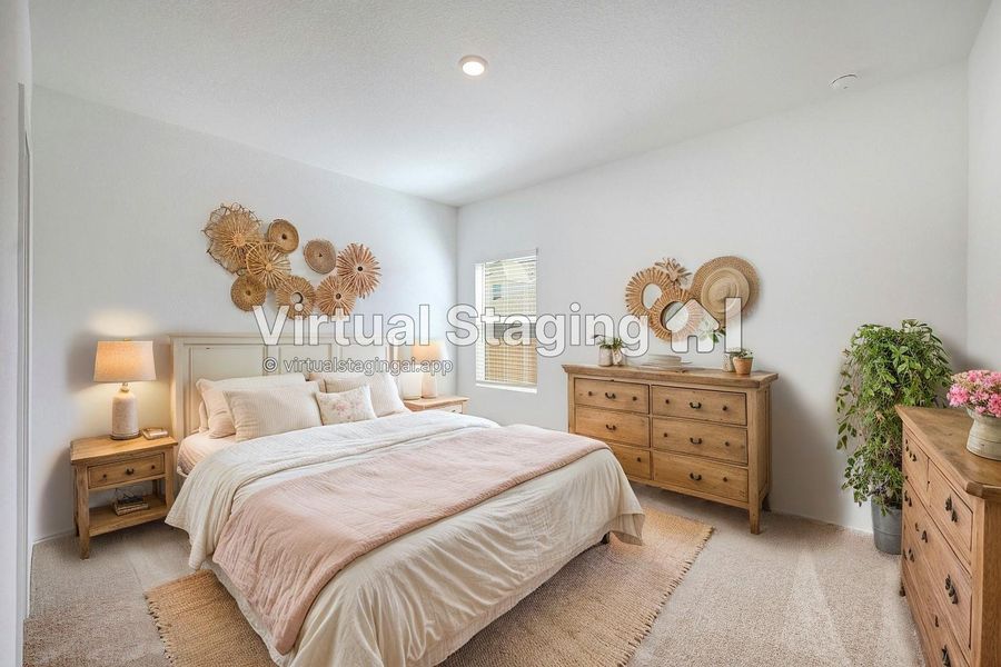 Bedroom featuring light colored carpet