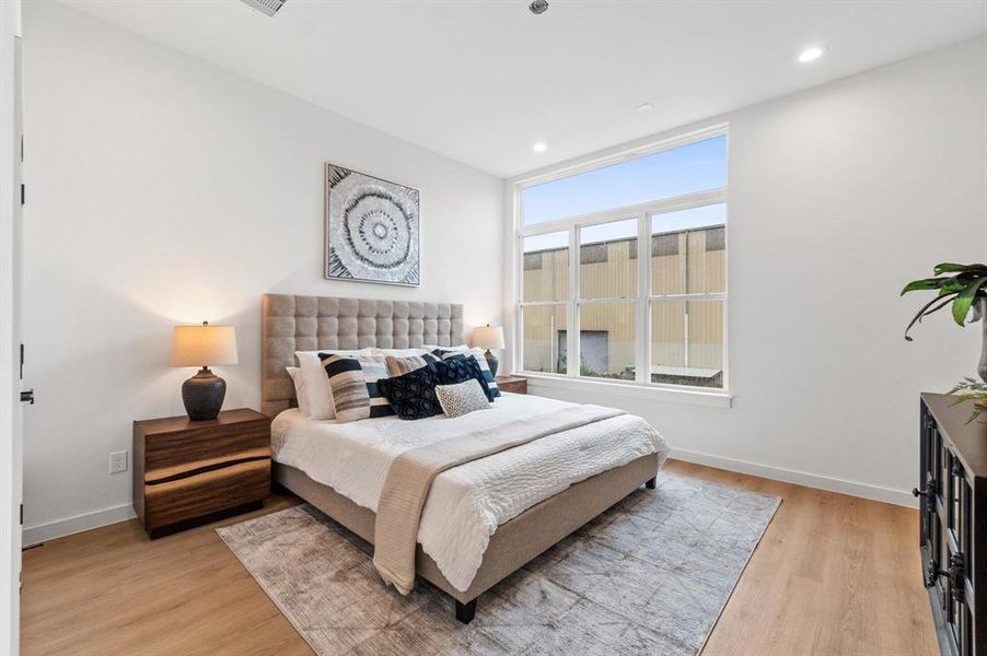 Primary bedroom with tons of natural light