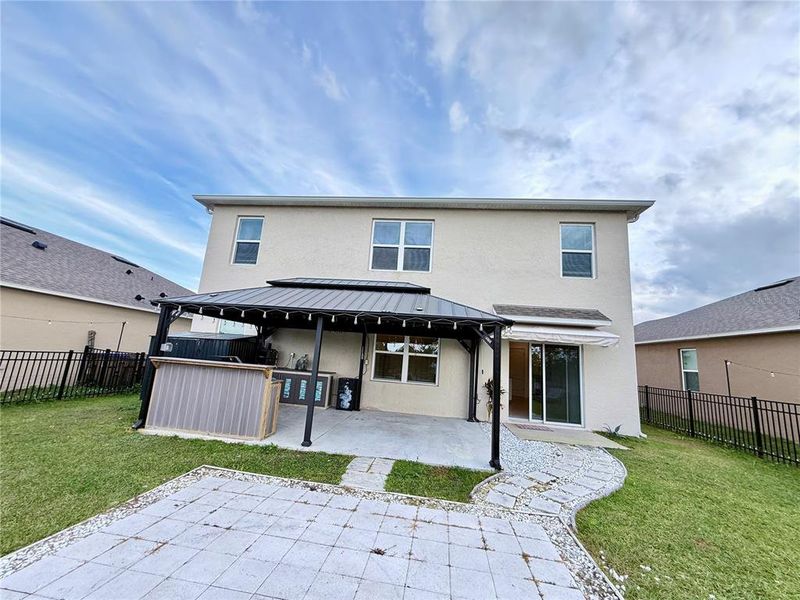 Exterior details and patio area of a home in Harmony West, St. Cloud (Image 3).