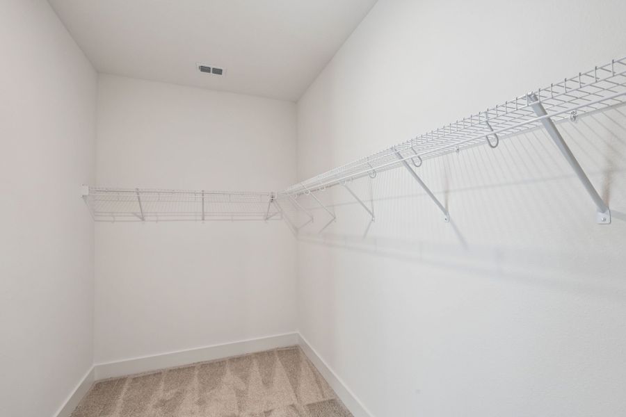 Primary Walk-In Closet Primary Walk-In Closet