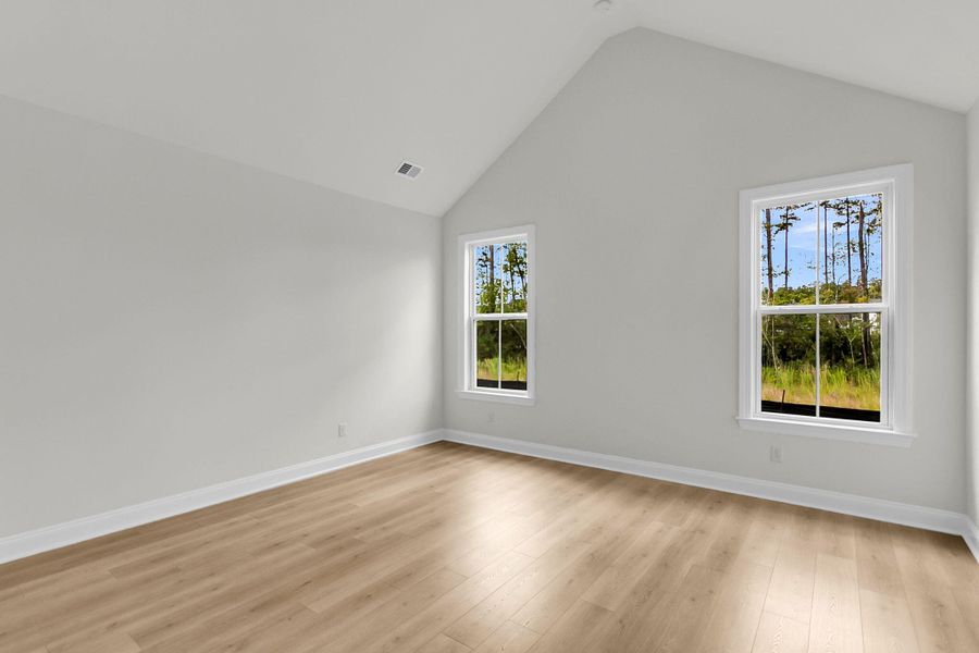 Spacious, unfurnished interior of a new home in Tidewater at Lakes of Cane Bay, Summerville (Image 17).