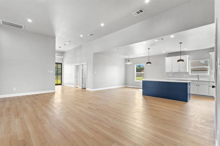 Unfurnished living room featuring recessed lighting and light wood-style floors