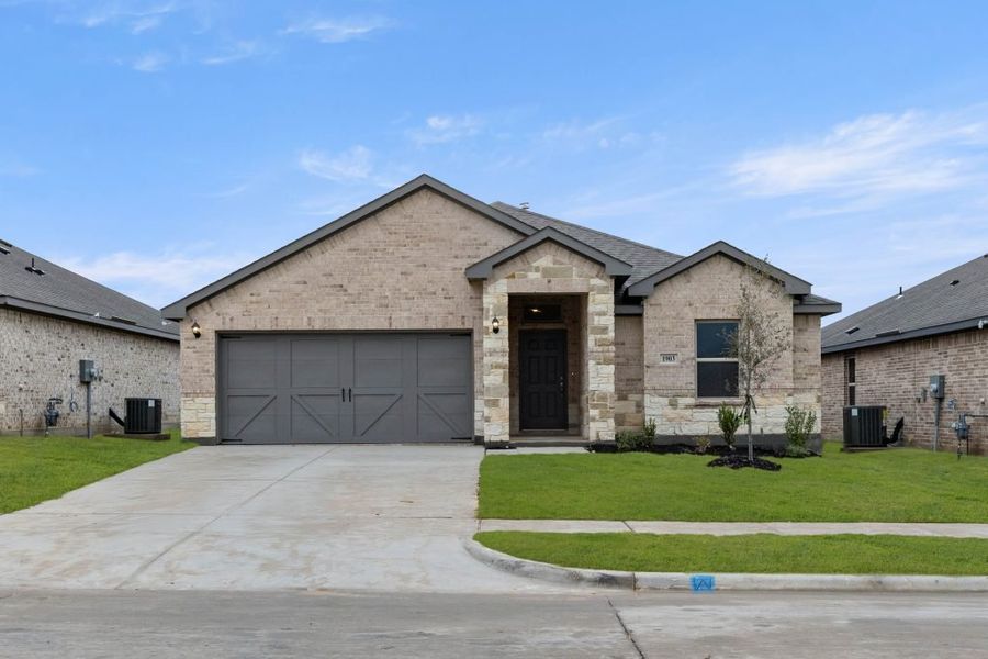 Representative exterior photo of a completed home built from the Lexington by Impression Homes in Baker Farms, Cleburne, TX (Image 1).