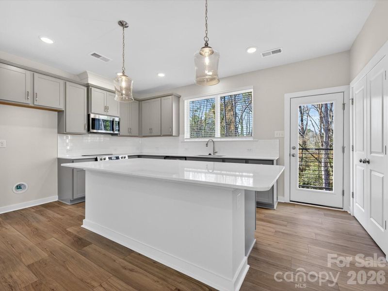 Furnished interior view inside a new home in Central Living at Craig, Charlotte (Image 5).