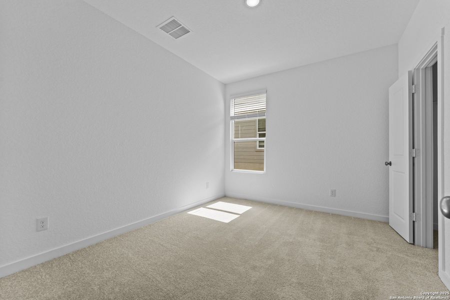 Spacious, unfurnished interior of a new home in Waterwheel: Coastline Collection, San Antonio (Image 17).