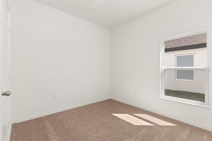 Spacious, unfurnished interior of a new home in Peach Crossings, Winter Haven (Image 17).