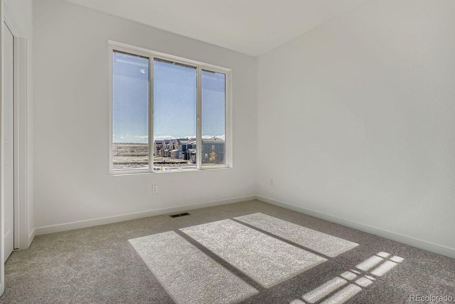 Spacious, unfurnished interior of a new home in Parterre: The Parkside Collection, Thornton (Image 7).