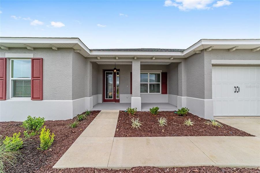 Front exterior of a new home in On Top of the World Communities, Ocala, FL, highlighting curb appeal (Image 22). Front exterior of a new home in On Top of the World Communities, Ocala, FL, highlighting curb appeal (Image 22).
