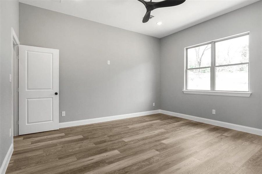Unfurnished room featuring a ceiling fan, wood finished floors, and recessed lighting Unfurnished room featuring a ceiling fan, wood finished floors, and recessed lighting