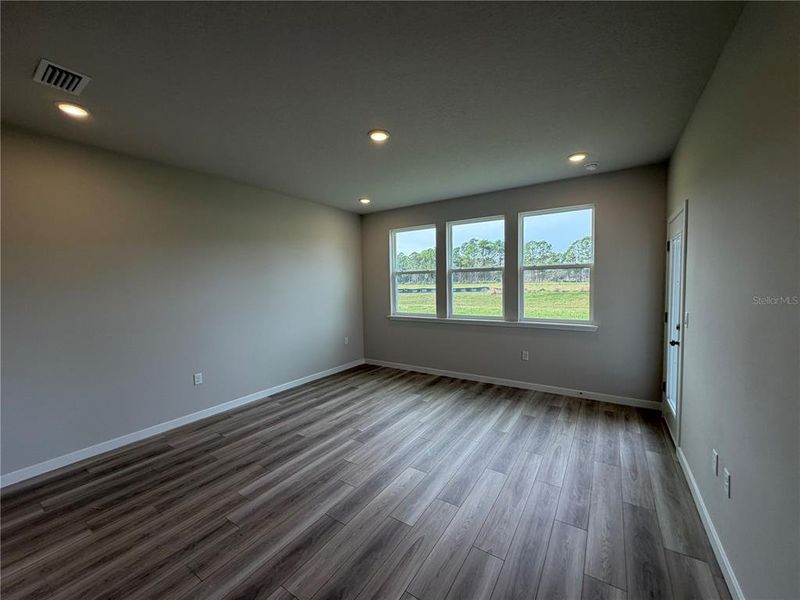 Spacious, unfurnished interior of a new home in The Cypress Series at Reserve East, Flagler Beach (Image 37).